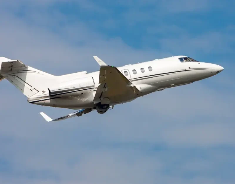 Private jet options include a sleek white business jet taking off into a clear blue sky.