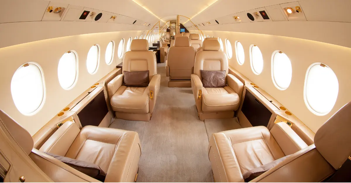 Private jet charter flights offer luxurious leather seating and spacious cabin interior.